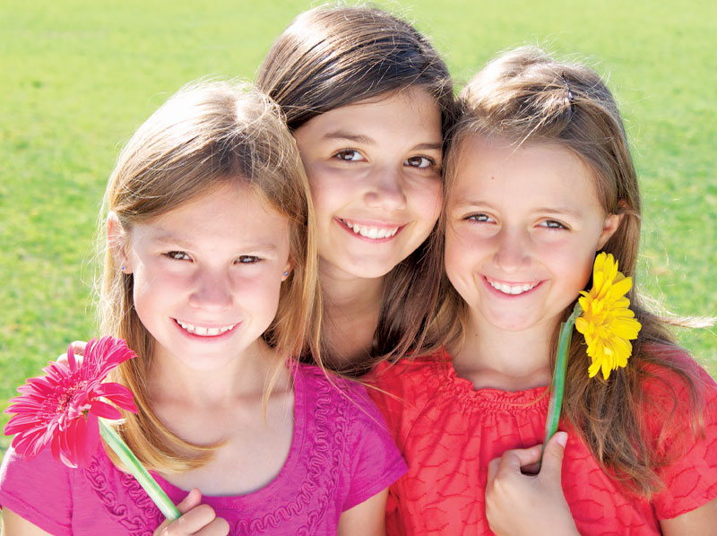 three smiling irls